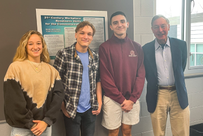  3 students with visitor Ted Dintersmith